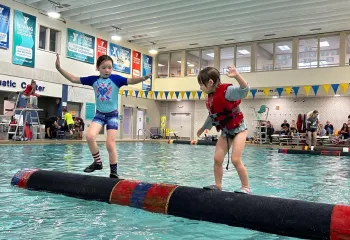 two kids logrolling