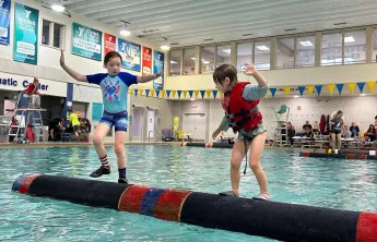 two kids logrolling